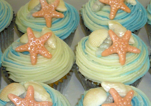 Cup cakes with iced starfish on them